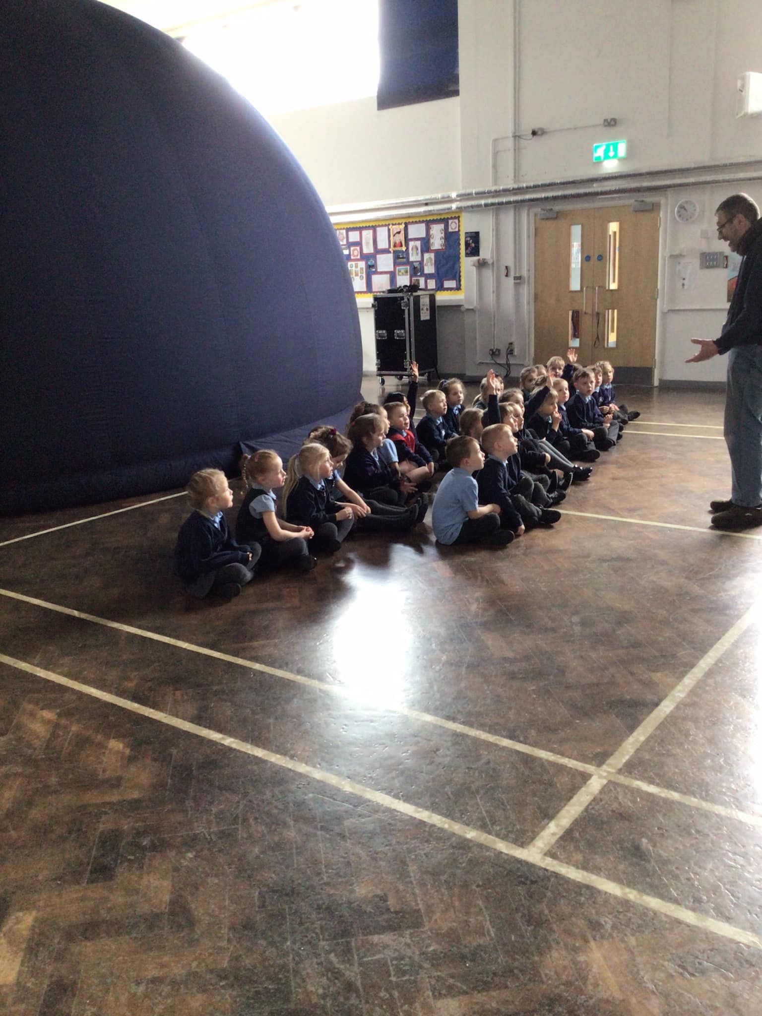 Pupils and presenter share a Science Dome school session